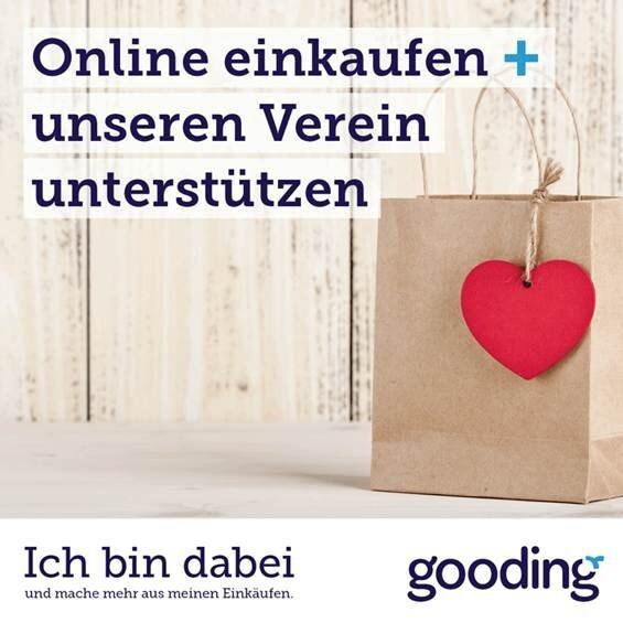 Papiertragetasche mit rotem Herzsymbol auf einem Holzuntergrund, unterst&uuml;tzt durch einen Online-Einkaufsaufruf.