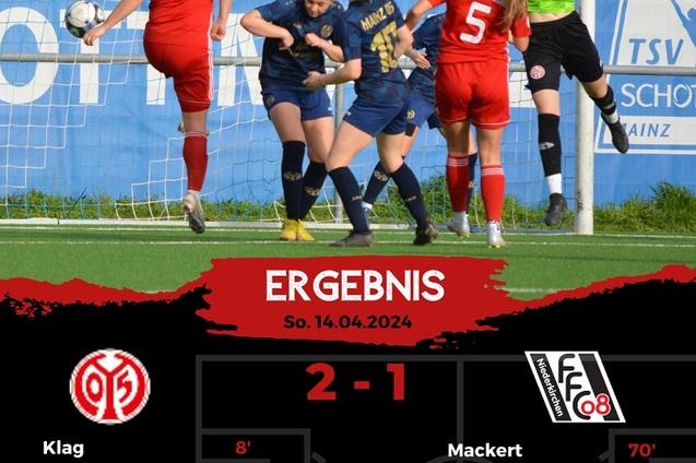 Spielszene mit zwei Frauenfu&szlig;ballmannschaften, eine Spielerin schie&szlig;t, w&auml;hrend andere in der N&auml;he agieren. Ergebnis 2-1.